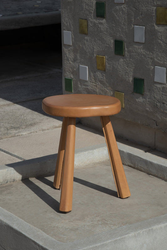 Stool covered in natural leather